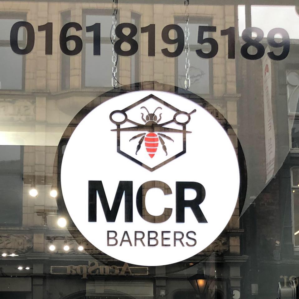 A barber at work at Manchester Barbers
